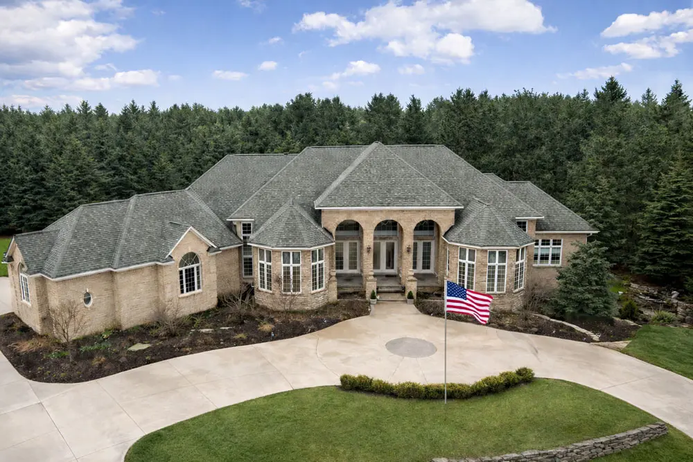 Spacious brick mansion with flag